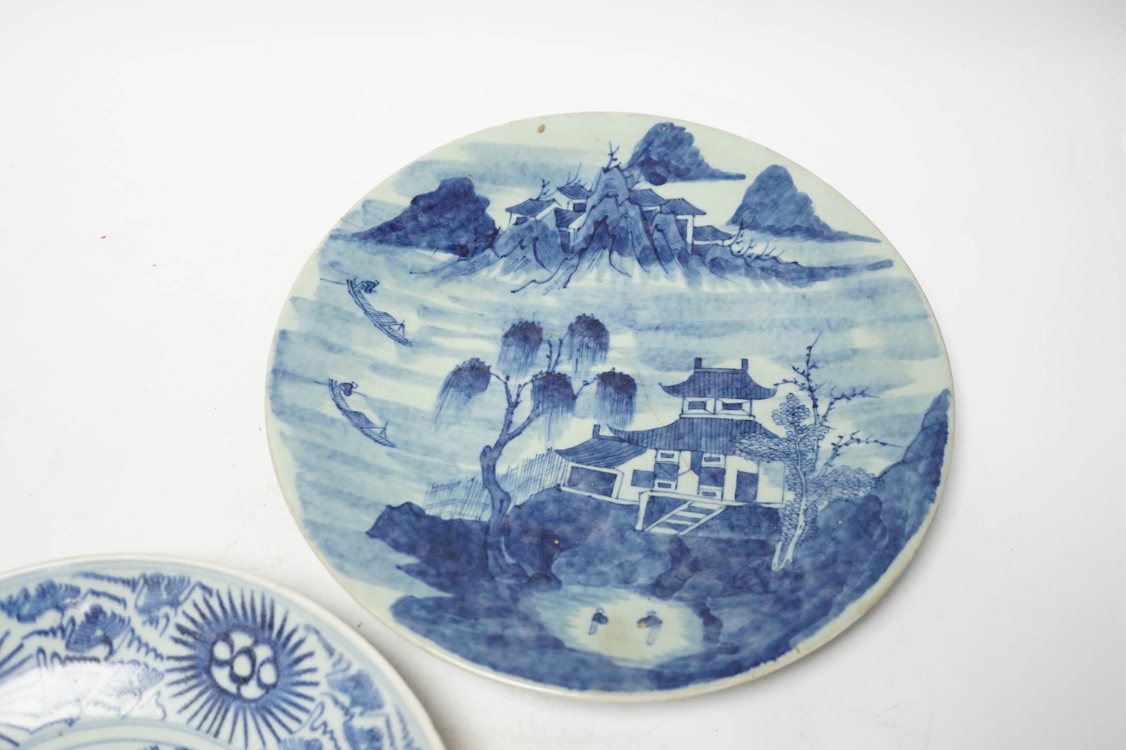 A 19th century Chinese celadon glazed blue and white landscape dish and a Diana Cargo dish, landscape dish 29.5cm diameter